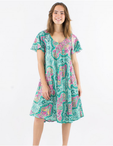 Polyester dress with short sleeves and "magic dore" print