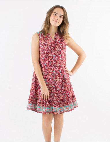 Polyester sleeveless dress with front pockets and "floral" print
