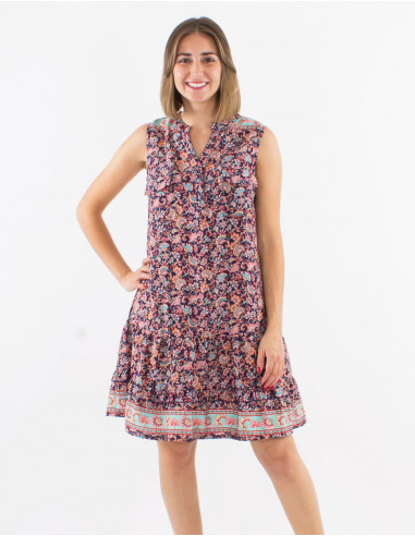 Polyester sleeveless dress with front pockets and "floral" print