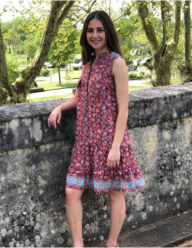 Polyester sleeveless dress with front pockets and "floral" print